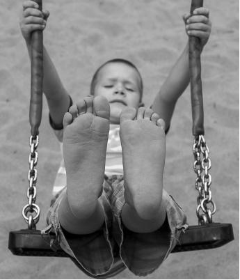 Child swinging on a playground swing